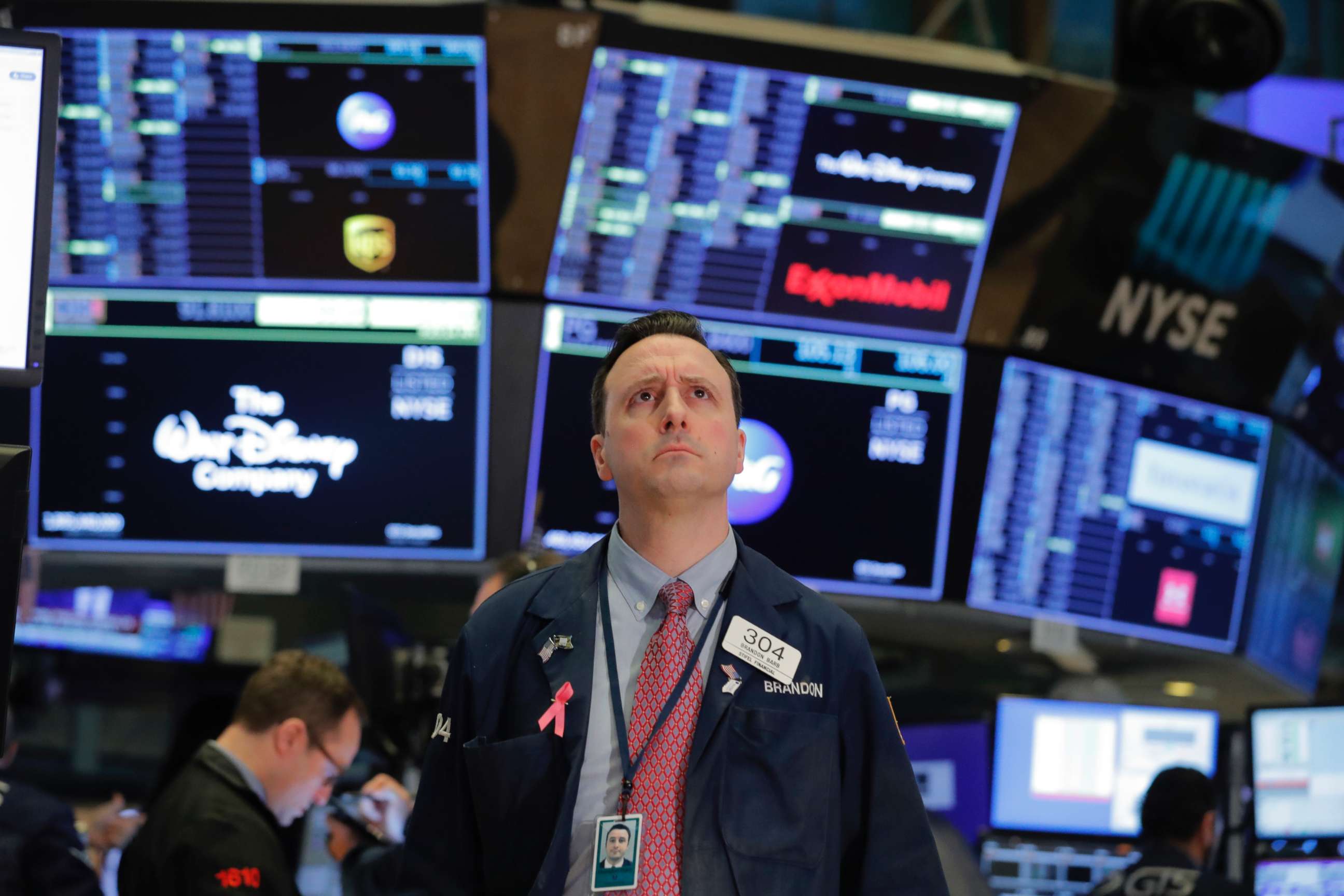 PHOTO: A trader works on the floor of the New York Stock Exchange shortly after the opening of trading in New York, March 13, 2020.