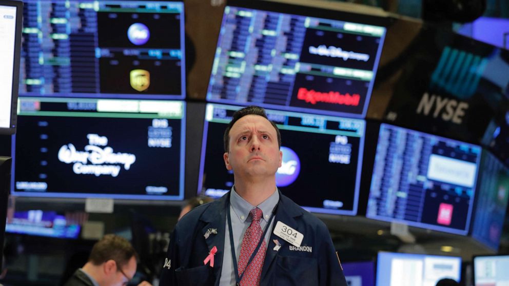 PHOTO: A trader works on the floor of the New York Stock Exchange shortly after the opening of trading in New York, March 13, 2020.