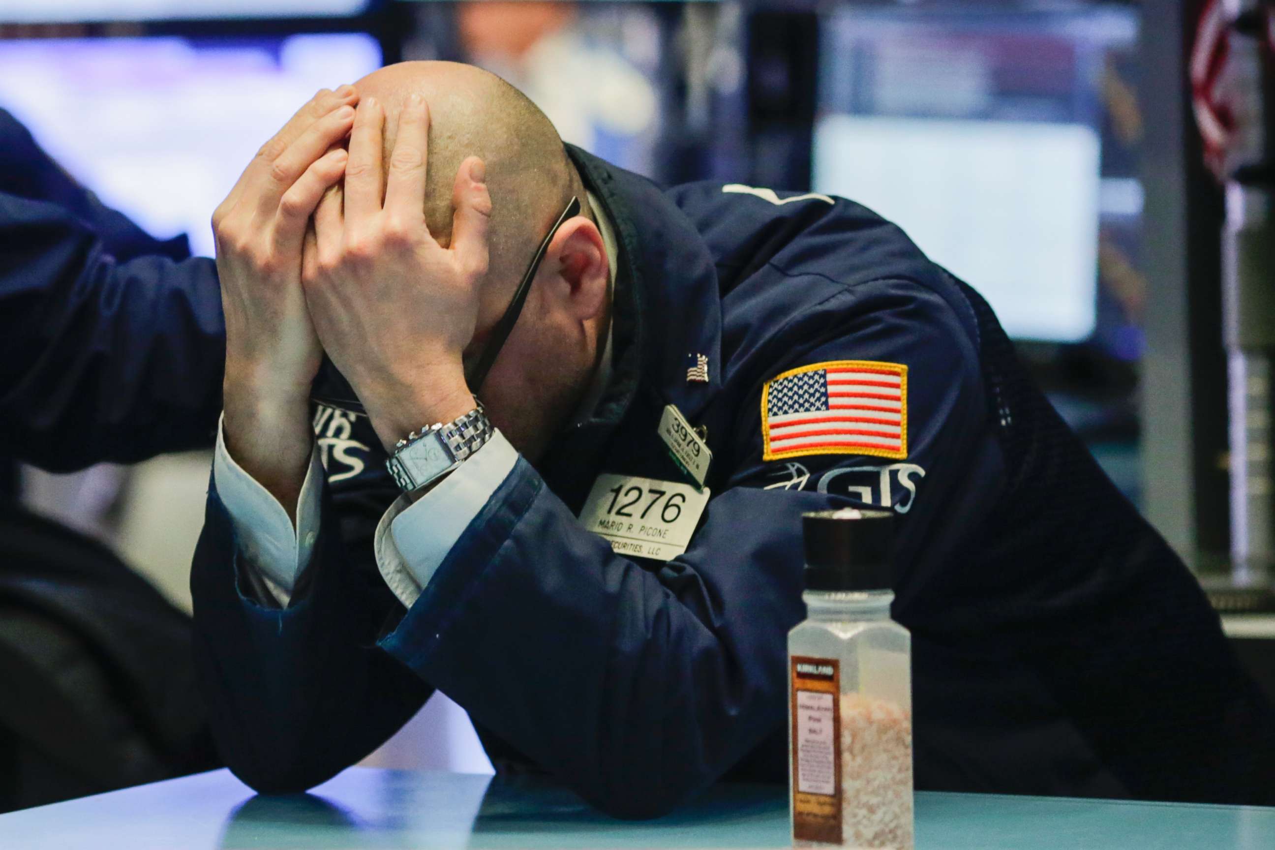 A trader reacts on the floor of the New York Stock Exchange (NYSE) on March 1, 2018, in New York City. Major stock indexes plunged following President Trump's announcement he was imposing a 25 percent tariff on imported steel and 10 percent on aluminum. 