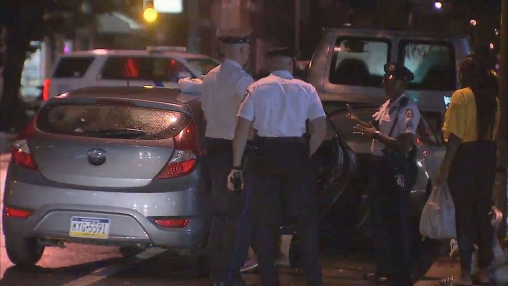 PHOTO: Police officers are shown with the car that had been stolen while children were inside on July 11, 2019 in Philadelphia.