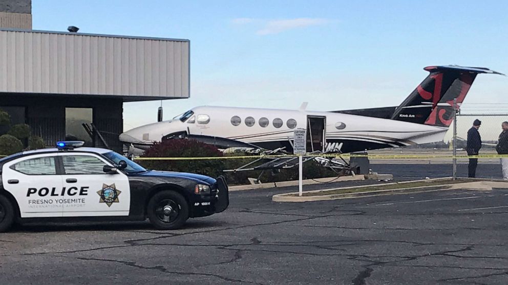 PHOTO: A small plane sits parked after it was crashed into a fence by a 17-year-old girl, Dec. 18, 2019, at the Fresno Yosemite International Airport in Fresno, Calif. 