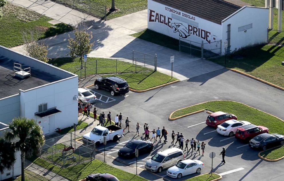 PHOTO: Students are evacuated by police out of Marjory Stoneman Douglas High School in Parkland, Fla., after a shooting on Wednesday, Feb. 14, 2018. 