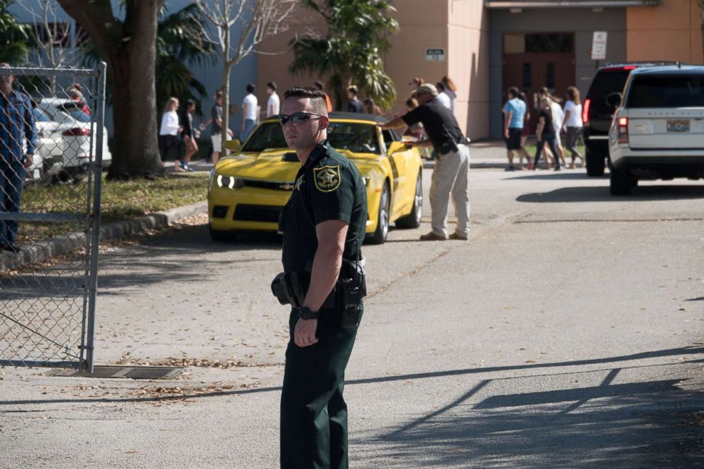 PHOTO: Students and parents arrive for voluntary campus orientation at the Marjory Stoneman Douglas High School, for the coming Wednesday's reopening, following a mass shooting in Parkland, Fla., Feb. 25, 2018.