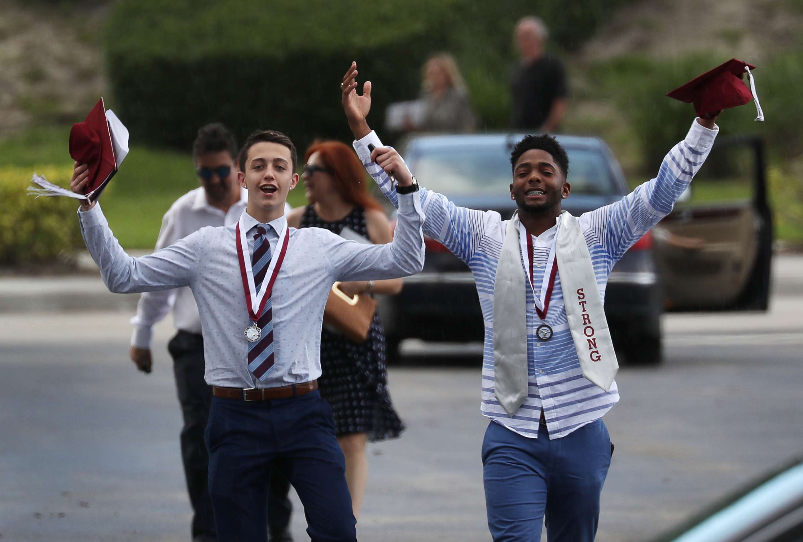 PHOTO: Graduates of  Marjory Stoneman Douglas High School are seen as they head to their cars after attending their graduation ceremony at the BB&T Center on June 3, 2018, in Sunrise, Florida.