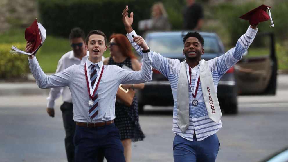 PHOTO: Graduates of Marjory Stoneman Douglas High School are seen as they head to their cars after attending their graduation ceremony at the BB&T Center on June 3, 2018, in Sunrise, Florida.