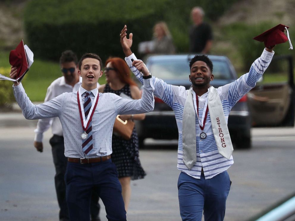 PHOTO: Graduates of Marjory Stoneman Douglas High School are seen as they head to their cars after attending their graduation ceremony at the BB&T Center on June 3, 2018, in Sunrise, Florida.