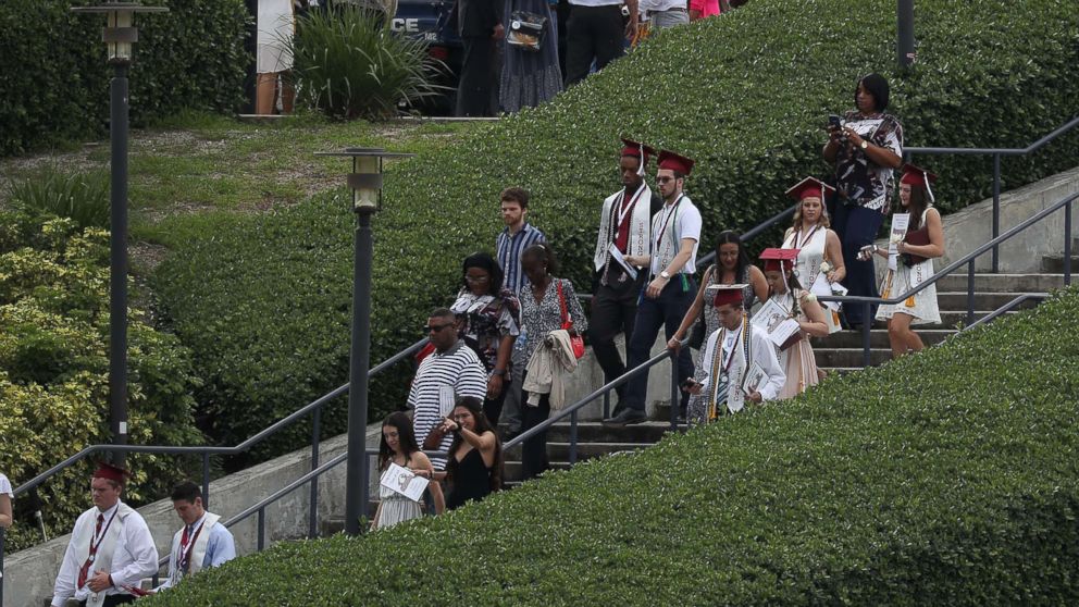 PHOTO: Graduates of  Marjory Stoneman Douglas High School are seen as they head to their cars after attending their graduation ceremony at the BB&T Center on June 3, 2018, in Sunrise, Florida.