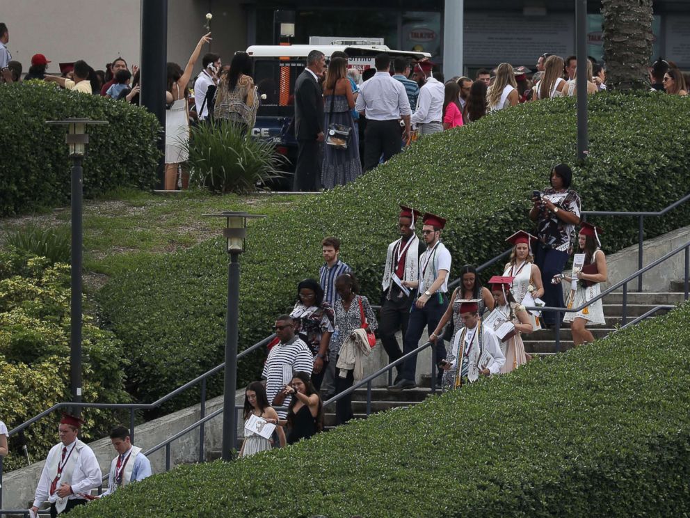 PHOTO: Graduates of Marjory Stoneman Douglas High School are seen as they head to their cars after attending their graduation ceremony at the BB&T Center on June 3, 2018, in Sunrise, Florida.