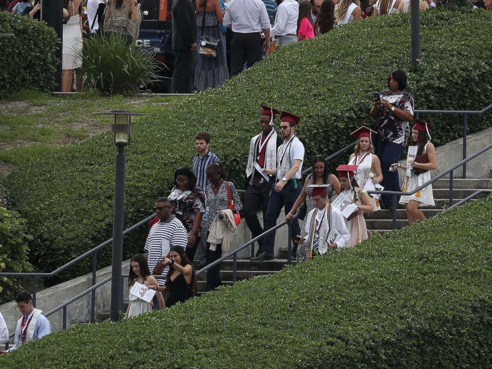 PHOTO: Graduates of  Marjory Stoneman Douglas High School are seen as they head to their cars after attending their graduation ceremony at the BB&T Center on June 3, 2018, in Sunrise, Florida.