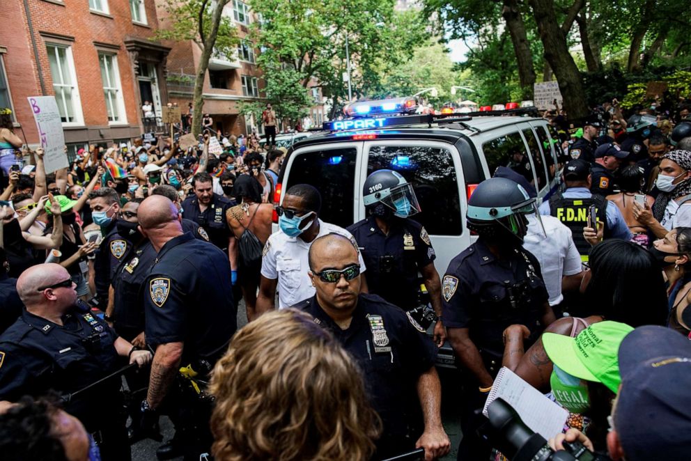 PHOTO: A demonstrator scuffles with a police officer during a joint LGBTQ and Black Lives Matter march on the 51st anniversary of the Stonewall riots in New York City, June 28, 2020.