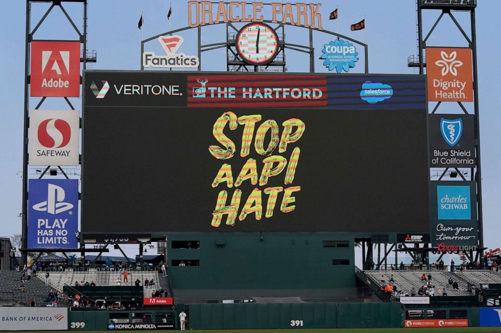 PHOTO: A Stop Asian American and Pacific Islander Hate message is shown on the video board at Oracle Park before a baseball game between the San Francisco Giants and the Colorado Rockies in San Francisco, Aug. 12, 2021. 