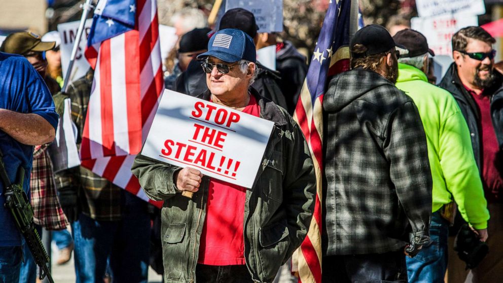 PHOTO: A protestor holds a placard saying "Stop the Steal" at the Nevada state's legislative building, Feb, 1, 2021, in Carson City, Nev.