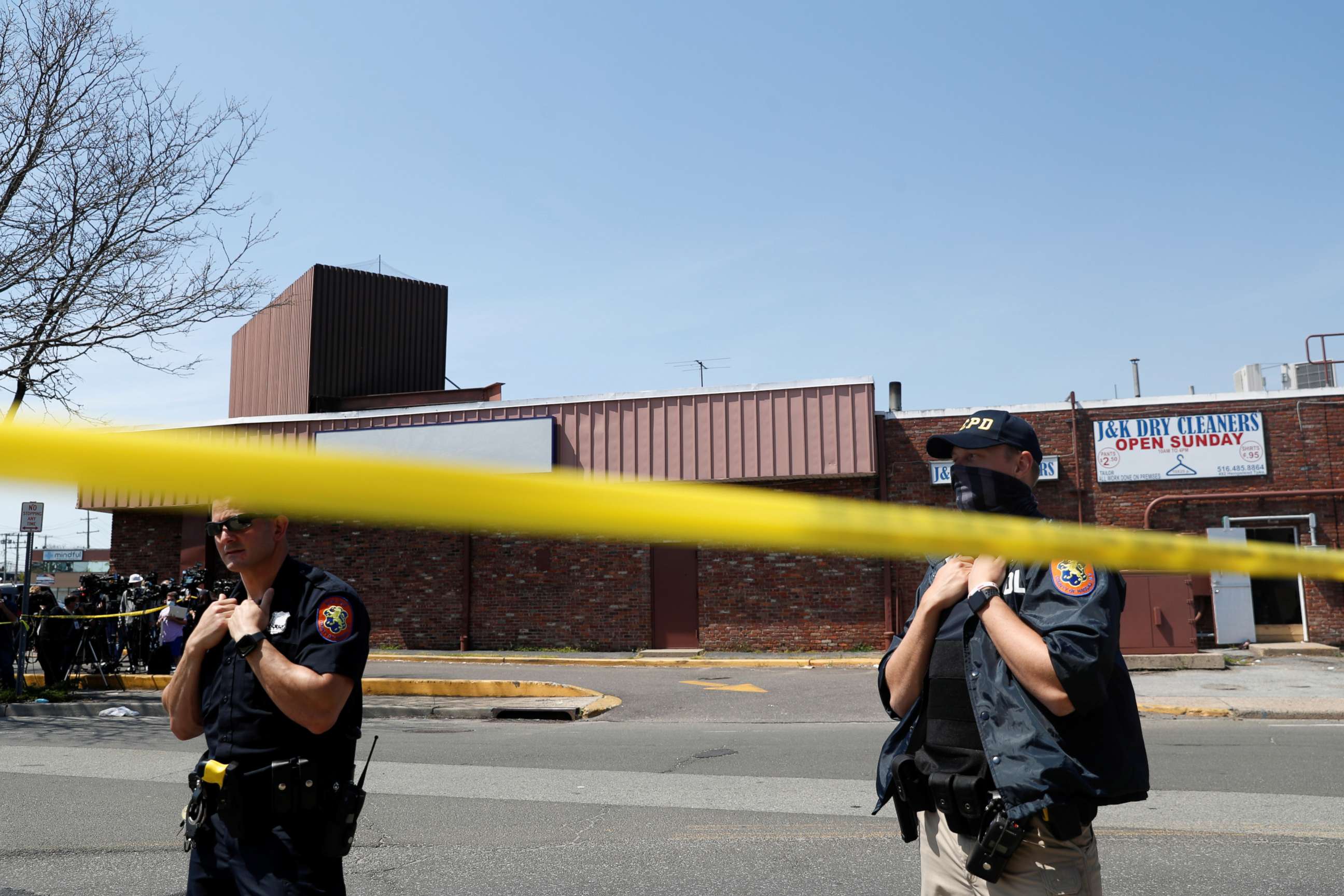 PHOTO: Law enforcement officers guard the scene of a shooting at a Stop and Shop grocery store in West Hempstead, New York, April 20, 2021.