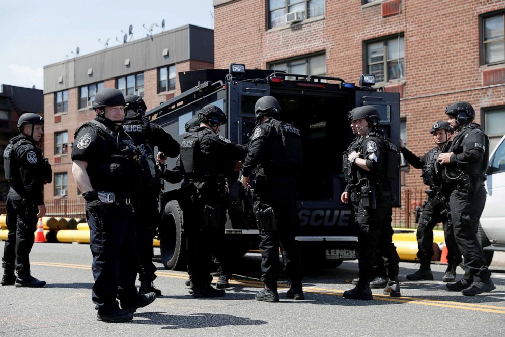 PHOTO: Law enforcement officers stand near the place where the shooter allegedly barricaded himself, after a shooting at a Stop and Shop grocery store, in Hempstead, New York, April 20, 2021.