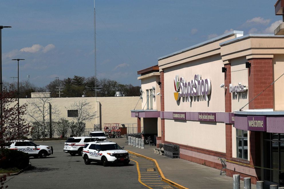 PHOTO: Police cars are seen on the site of a shooting, at a Stop and Shop grocery store, in West Hempstead, N.Y., April 20, 2021.