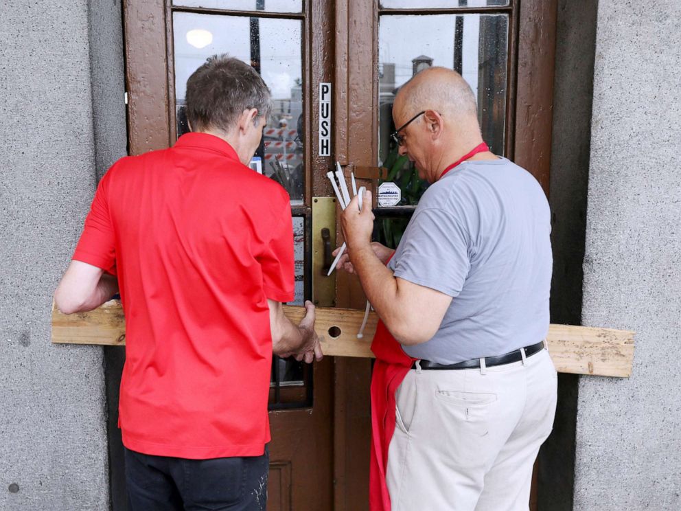PHOTO:Employees board up the entrance to a French Quarter restaurant as Tropical Storm Barry approaches land in New Orleans, July 12, 2019.