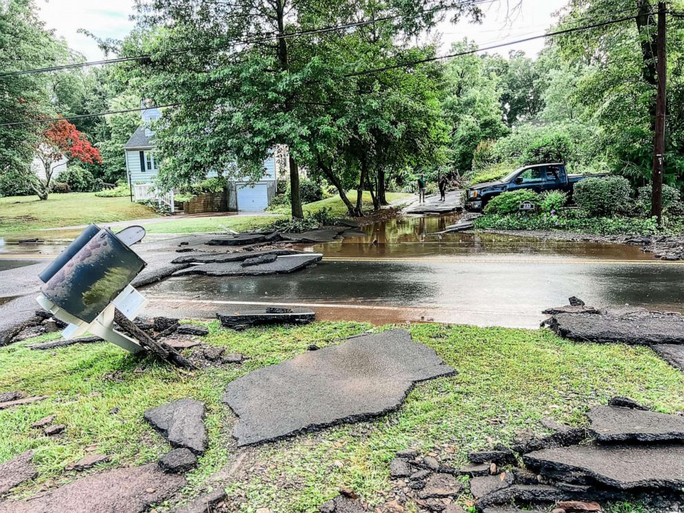 PHOTO: Pieces of asphalt are scattered after flash floods struck Yardley, Pa., July 16, 2023.