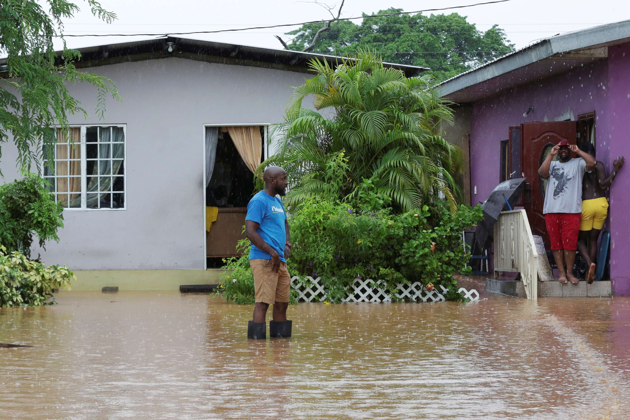 PHOTO: A resident wades through an area flooded by a rain storm caused by Tropical Storm Karen in Barataria, Trinidad and Tobago, Sept. 22, 2019.