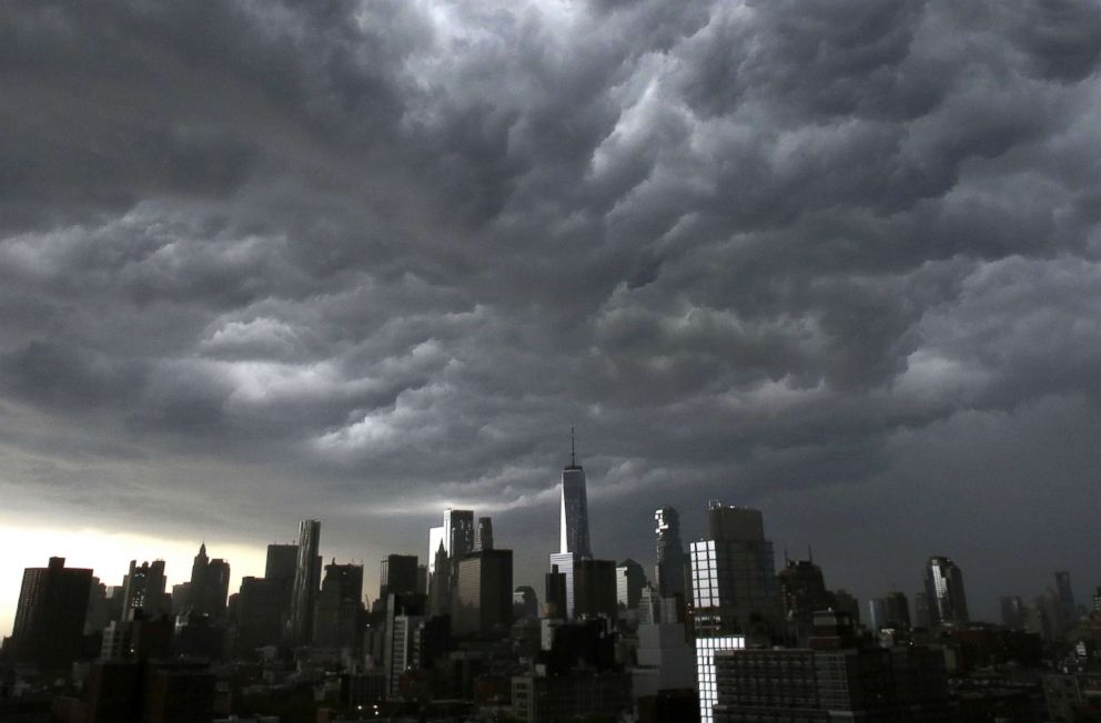 PHOTO: Dark storm clouds move over One World Trade Center in lower Manhattan as a thunder storm moves through the New York City area, May 15, 2018.