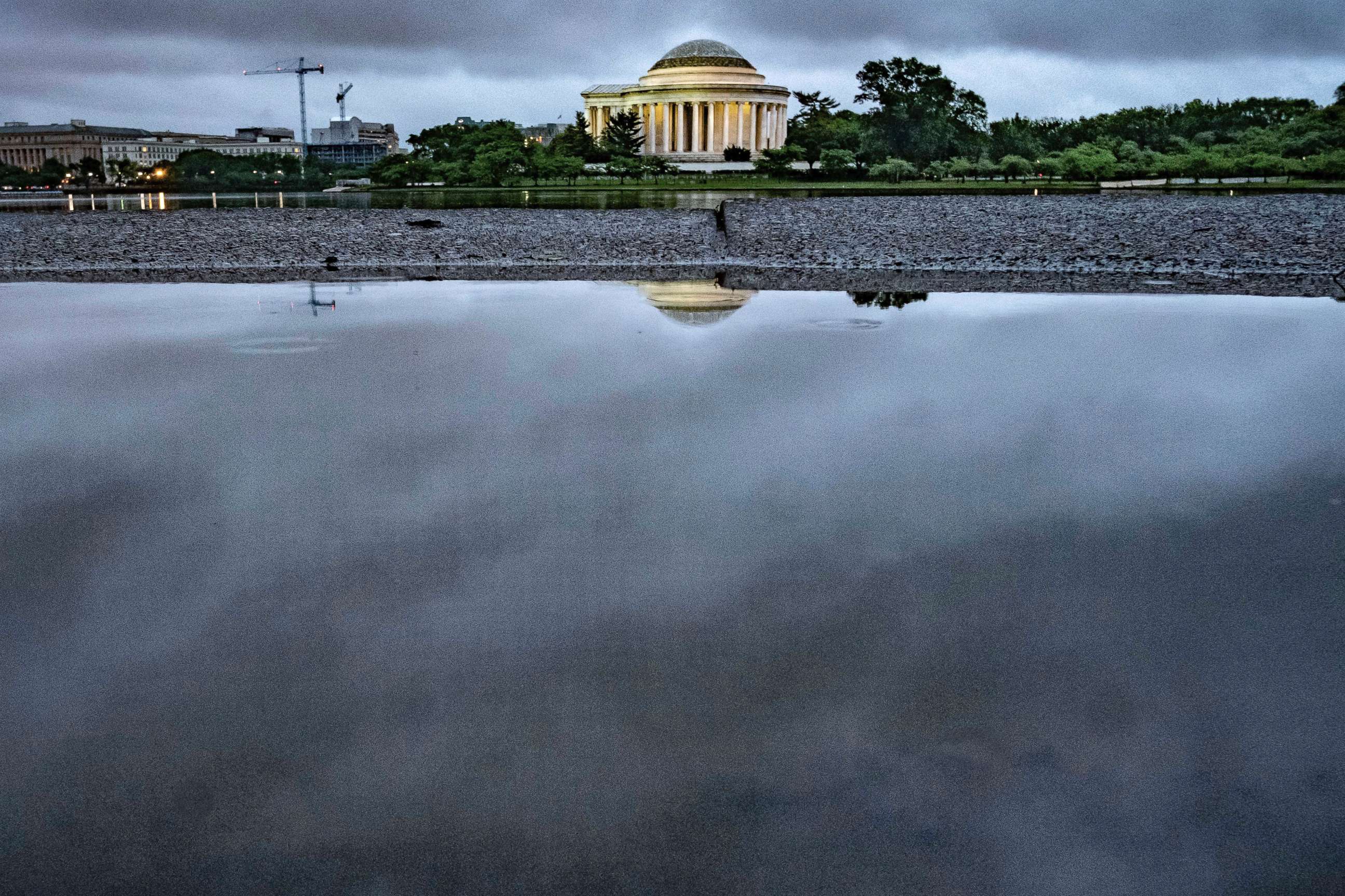 PHOTO: Storm clouds are reflected in a puddle near the Jefferson Memorial in Washington, May 16, 2018. Rain and thunderstorms are expected to continue in the Nation's Capital area for the next couple of day.