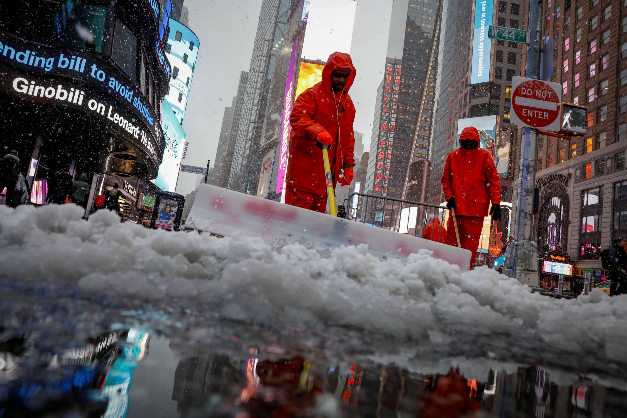 PHOTO: Workers clear snow during a winter nor'easter storm in Times Square in New York City, March 21, 2018.