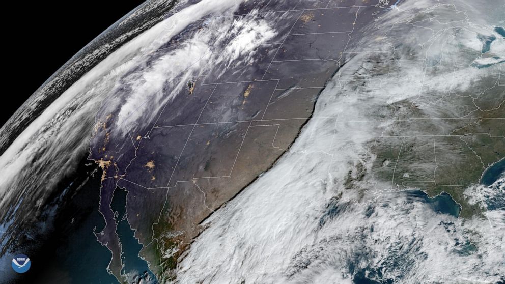 PHOTO: Two storms are shown moving across the United States on Dec. 20, 2019, that may hinder holiday travel through next week.