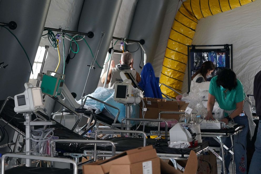 PHOTO: Medical supplies and beds are seen inside a tent as volunteers set up an Emergency Field Hospital for patients suffering from the coronavirus in Central Park across Fifth Avenue from Mt. Sinai Hospital, March 30, 2020, in New York. 