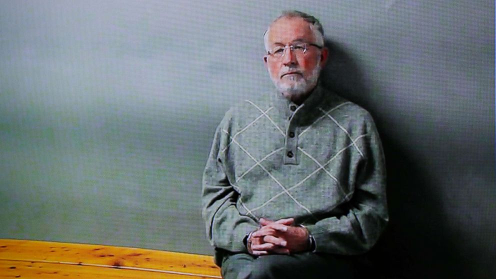 William Strampel appears on a monitor during his video arraignment, March 27, 2018, in East Lansing, Mich. Strampel, a Michigan State University official who oversaw Larry Nassar, was arrested March 26, amid an investigation into the handling of complaints against the former sport doctor who is in prison for sexually assaulting patients under the guise of treatment.