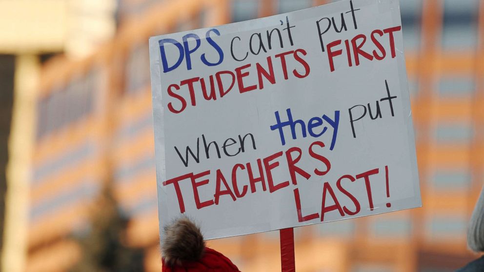 PHOTO: A teacher holds a placard during a rally by teachers from the Denver Public Schools outside the State Capitol, Jan. 30, 2019, in Denver.