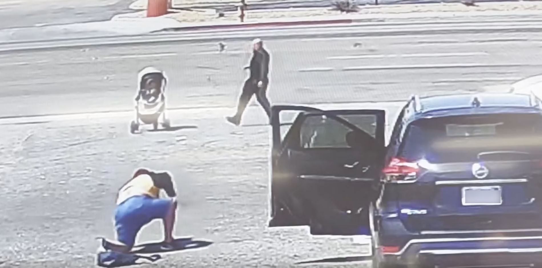 PHOTO: Security video shows a good Samaritan jump into action as the stroller was rolling toward heavy traffic in Hesperia, Calif.