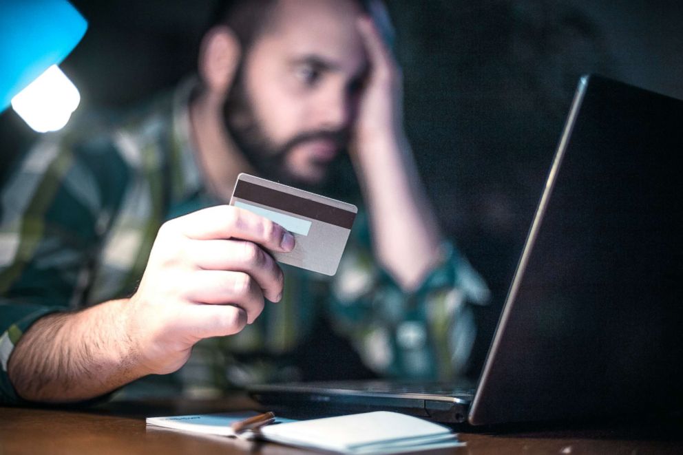 PHOTO: A man pays bills in this undated stock photo.