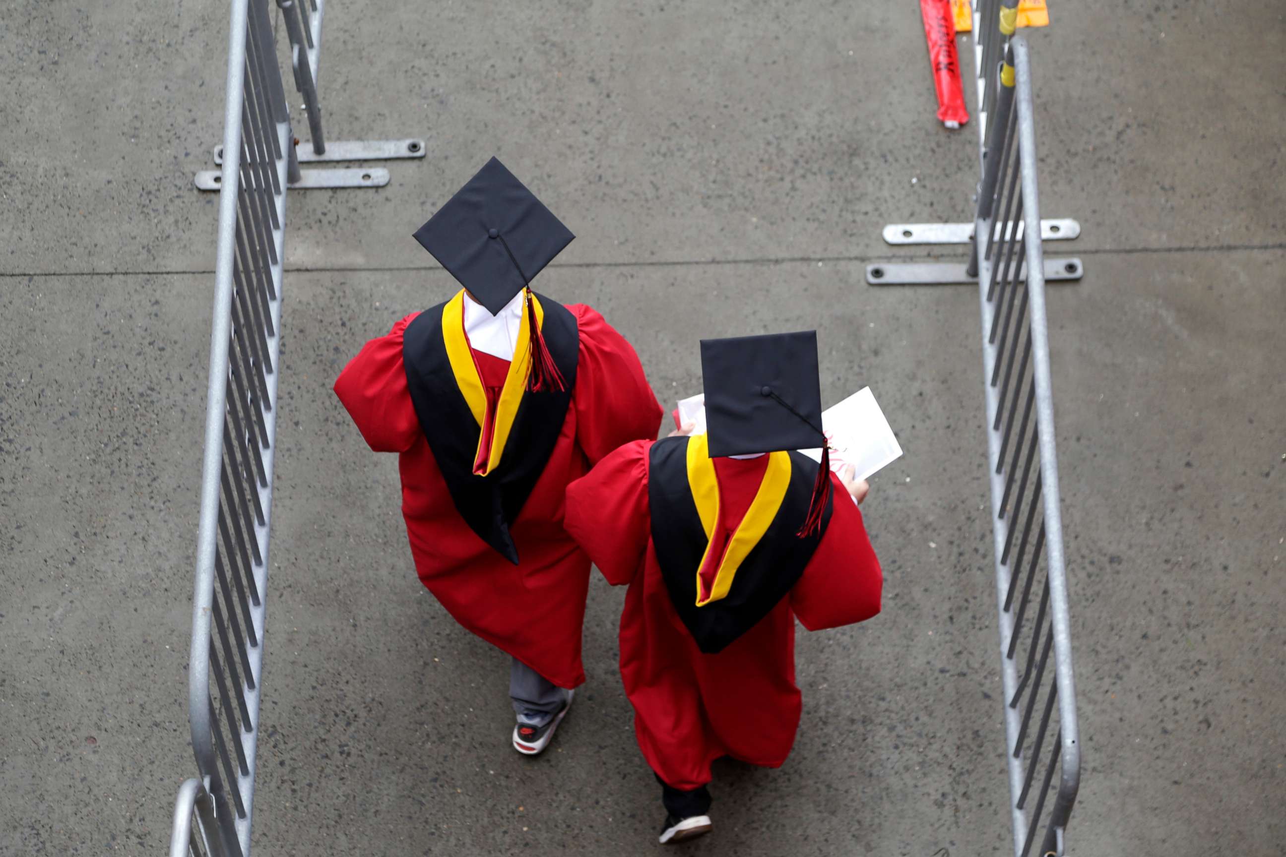 PHOTO: New graduates walk into the High Point Solutions Stadium before the start of the Rutgers University graduation ceremony in Piscataway Township, N.J., May 13, 2018.