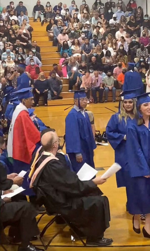 PHOTO: A student wears a Mexican flag over his graduation gown at his graduation ceremony, in an image taken from video provided by graduation attendee Adolfo Hurtado.