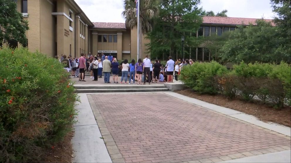 PHOTO: Students at University Lab School in Baton Rouge, Louisiana, hold a prayer circle for a fellow student reported missing in the Bahamas, May 25, 2023.