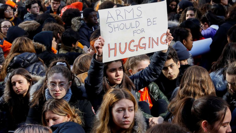 Students from Fiorello H. Laguardia High School sit down on West 62nd street in support of the National School Walkout in the Manhattan borough of New York, March 14, 2018.