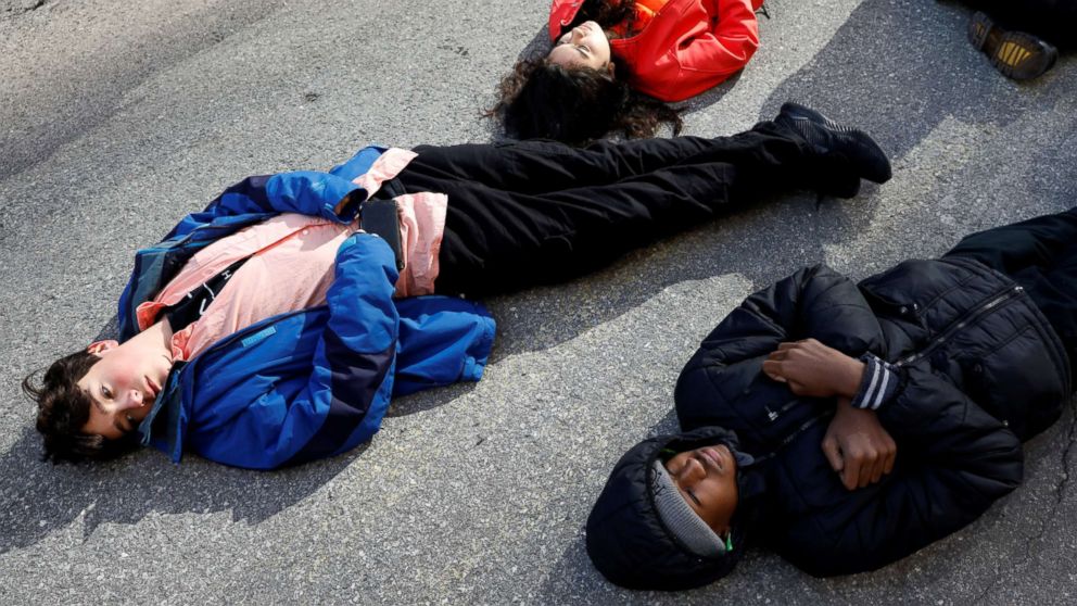 PHOTO: Students from Fiorello H. Laguardia High School lie down on West 62nd street in support of the National School Walkout in the Manhattan borough of New York, March 14, 2018.