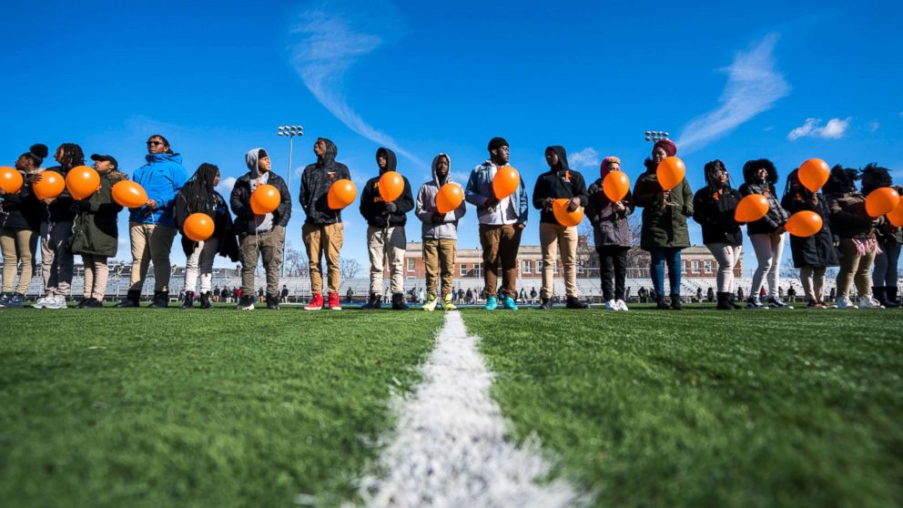 Eastern High School students walk out of class and assemble on their football field for the National School Walkout, a nation-wide protest against gun violence, in Washington, March 14, 2018.