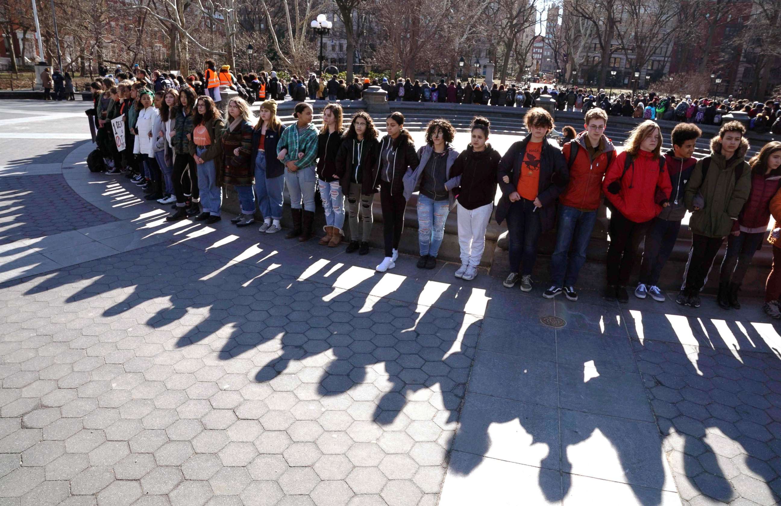 PHOTO: Students from Harvest Collegiate High School form a circle around the fountain in Washington Square Park, March 14, 2018, in N.Y. to take part in a national walkout to protest gun violence.