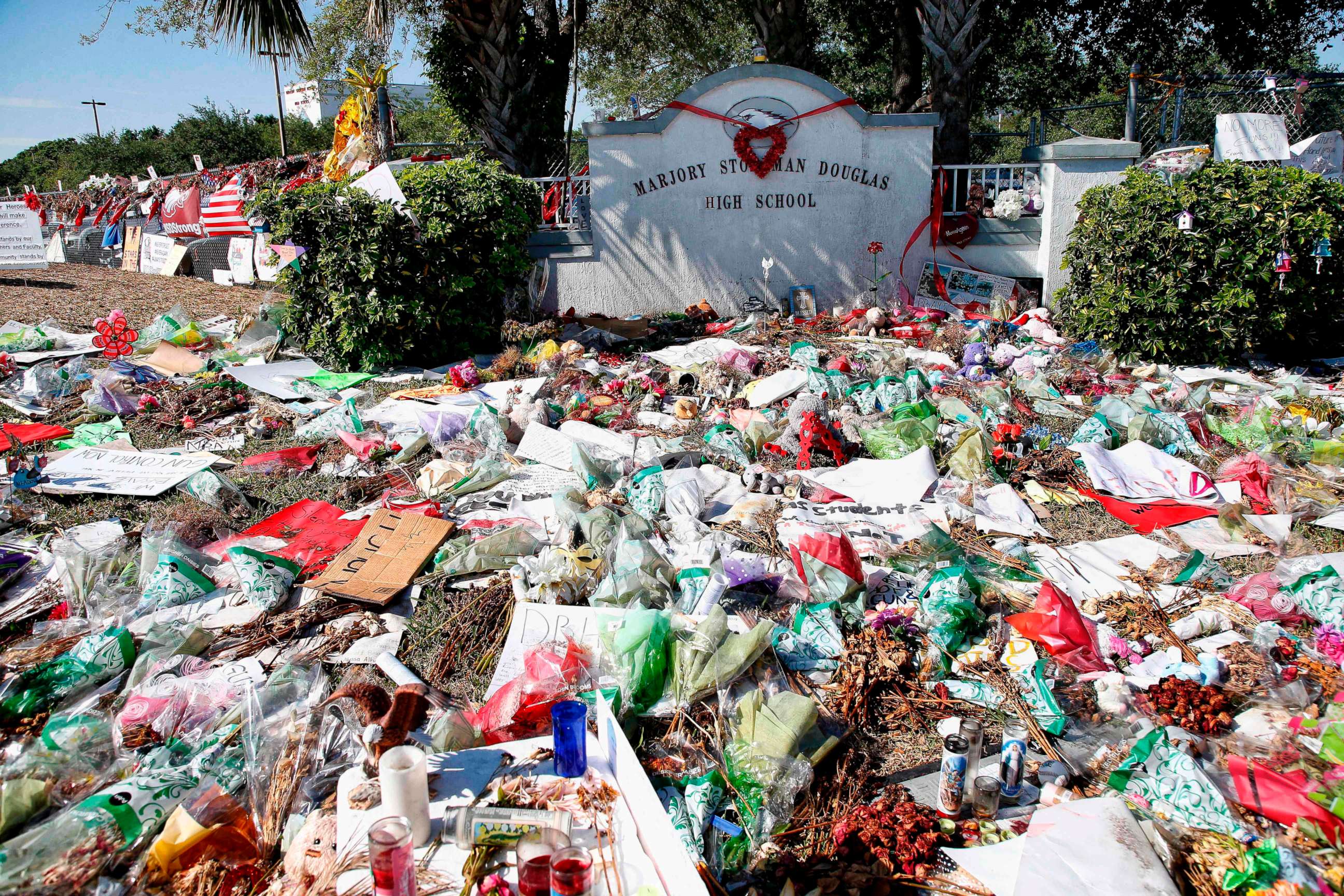 PHOTO: A general view of the makeshift memorial in front of Marjory Stoneman Douglas High School as staff, teachers and students walk out of classes to protest gun violence in Parkland, Fla. March 14, 2018.