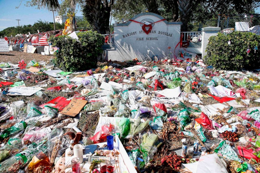 PHOTO: A general view of the makeshift memorial in front of Marjory Stoneman Douglas High School as staff, teachers and students walk out of classes to protest gun violence in Parkland, Fla., on March 14, 2018.