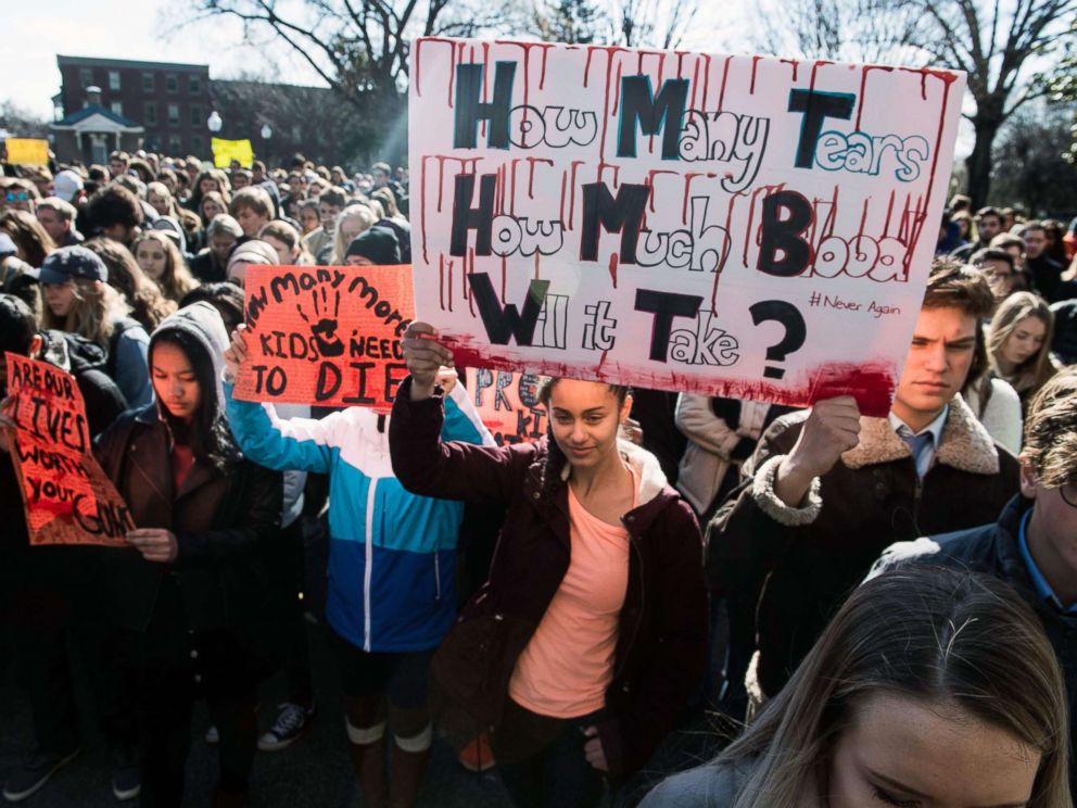 PHOTO: A student holds a sign at Georgetown University in Washington, D.C., March 14, 2018, during a National Walkout to protest gun violence, one month after the school shooting in Parkland, Fla., in which 17 people were killed.