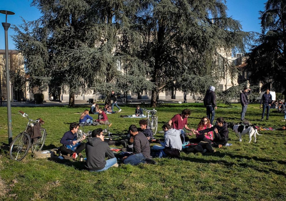 PHOTO: Students of the Milan's Politecnico University gather in a park outside their university, Milan, Italy, March 4, 2020. The government has decided to close schools and universities until mid-March to reduce the risk of contagion of the coronavirus.