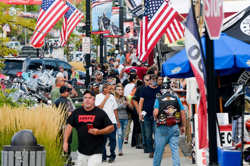 PHOTO: People walk along Main Street a day before the start of the Sturgis Motorcycle Rally, Aug. 6, 2020 in Sturgis, S.D.