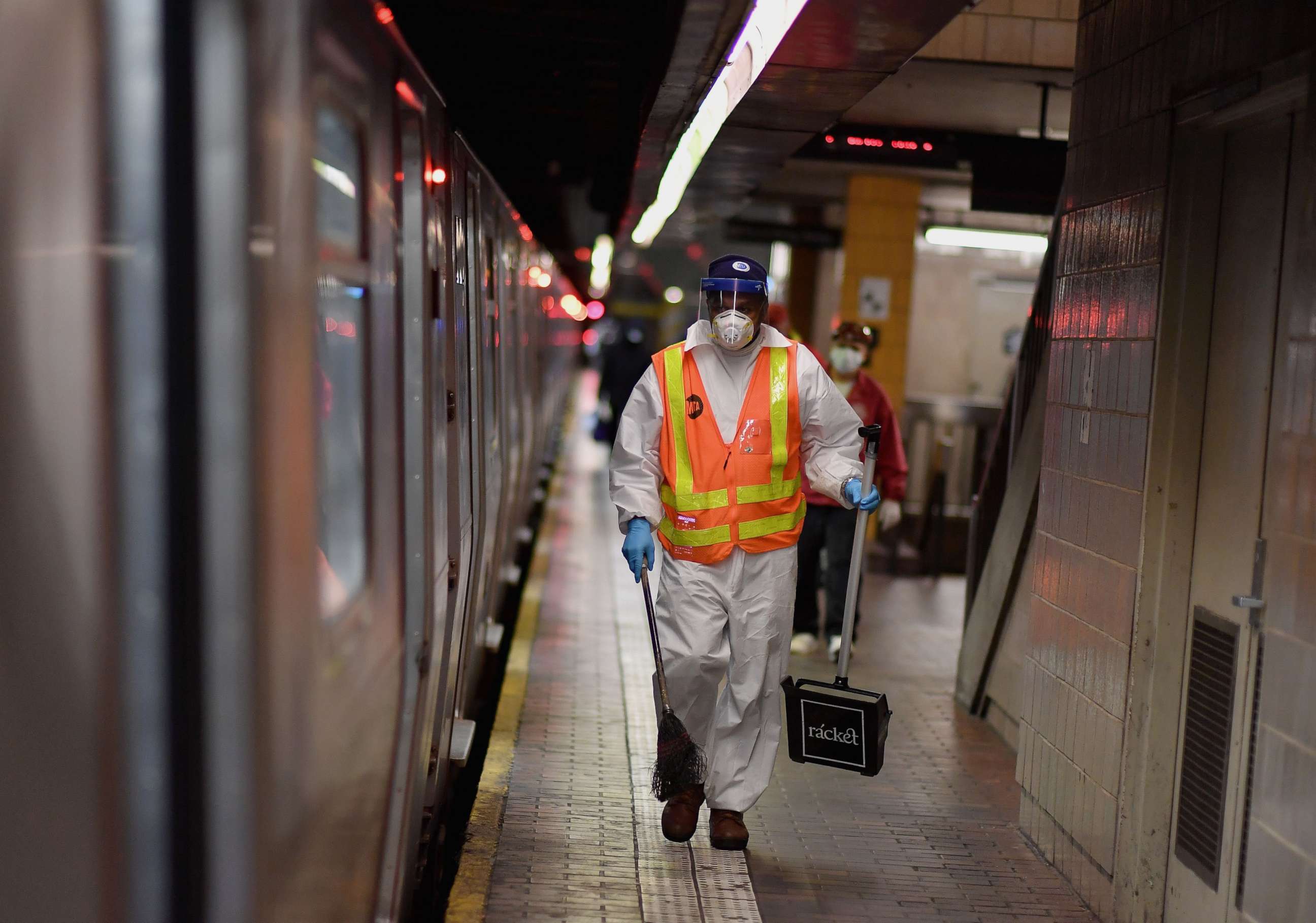 PHOTO: An MTA worker cleans subway trains at a station, May 7, 2020, in New York City.