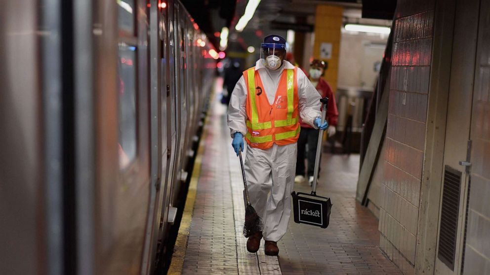 PHOTO: An MTA worker cleans subway trains at a station, May 7, 2020, in New York City.