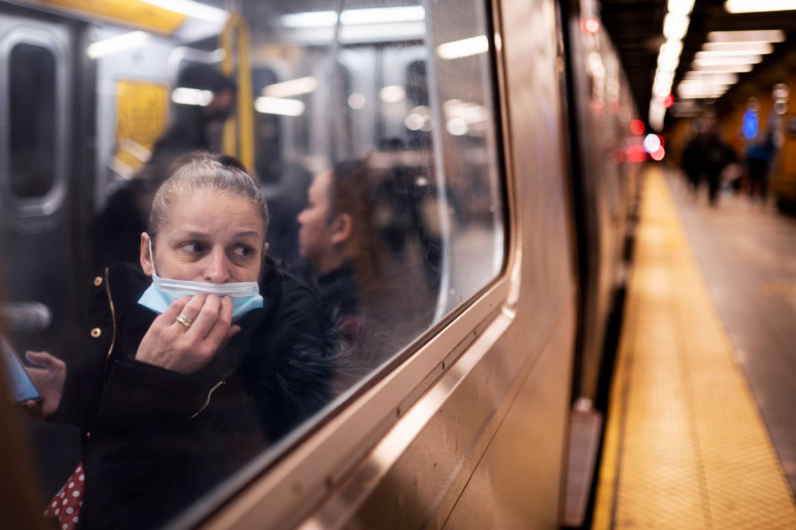 PHOTO: A passenger looks out onto the platform while riding a northbound train in 36th Street subway station where a shooting attack occurred the previous day during the morning commute, April 13, 2022, in New York. 