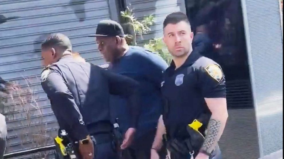 PHOTO: Frank James is taken into custody by the NYPD as a suspect in the April 12 shooting on the Subway in the East Village are of New York, April 13, 2022.