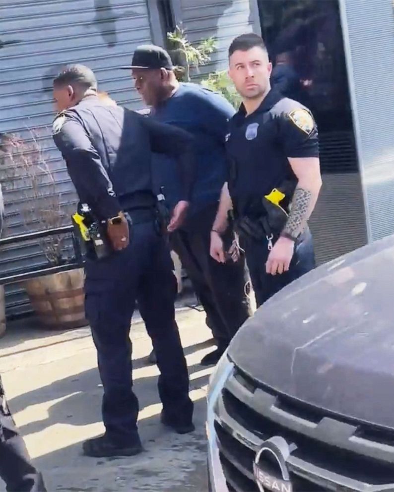 PHOTO: Frank James is taken into custody by the NYPD as a suspect in the April 12 shooting on the Subway in the East Village are of New York, April 13, 2022.