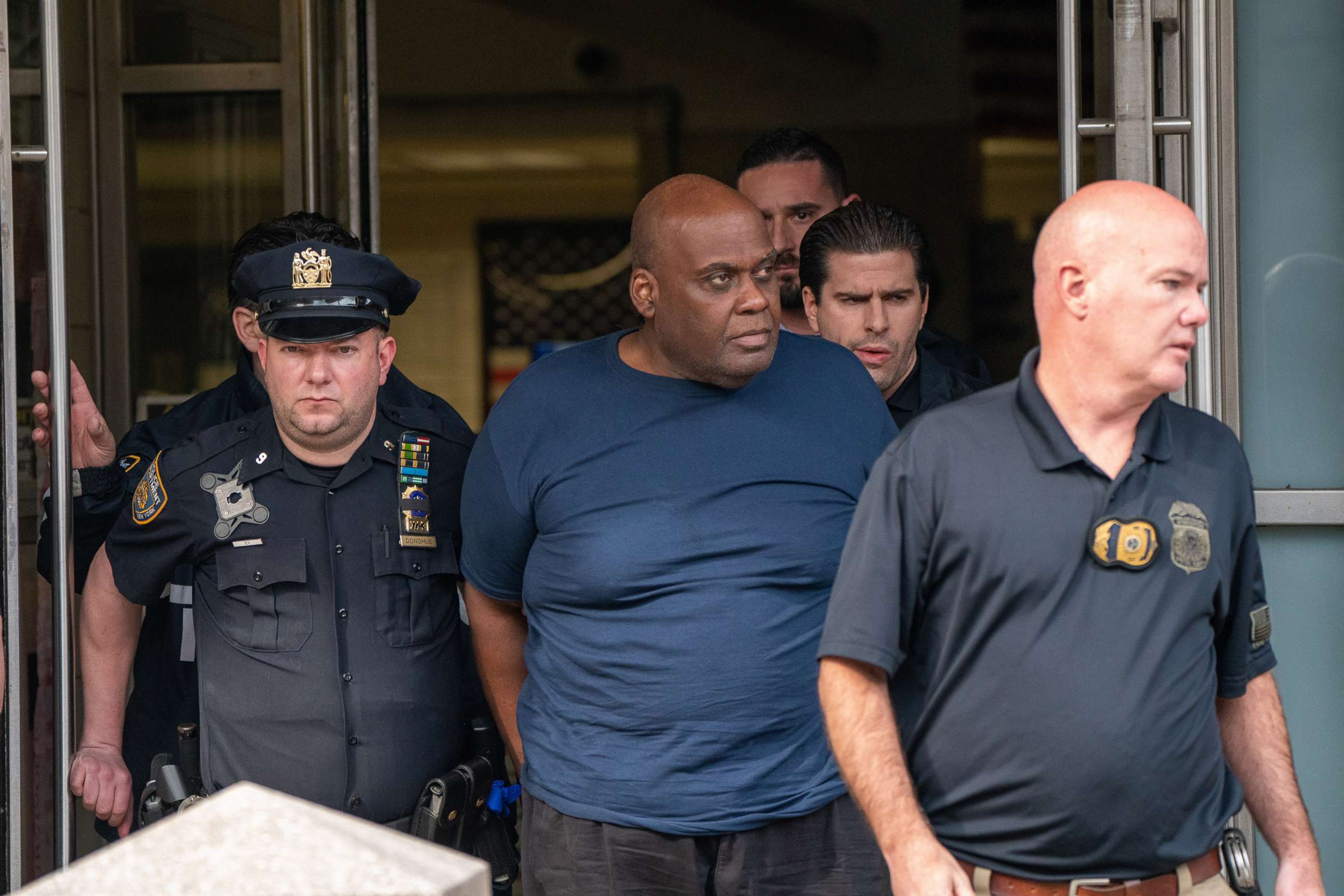 PHOTO: Suspect Frank James is escorted out of the 9th Precinct by police after being arrested for his connection to the mass shooting at the 36 St subway station in New York, April 13, 2022.