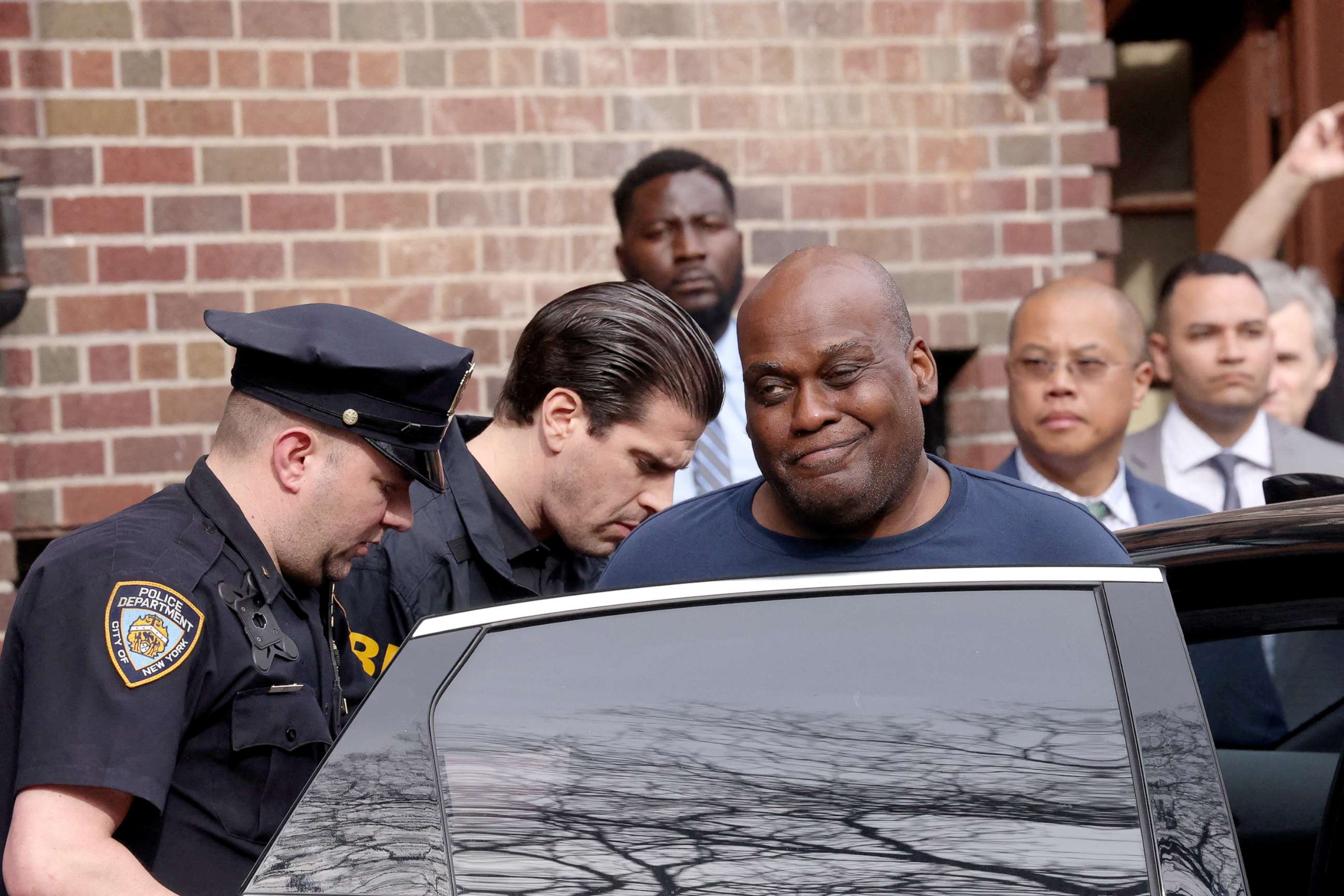 PHOTO: Frank James, the suspect in the Brooklyn subway shooting, reacts as he is escorted to a vehicle after leaving an NYPD precinct in New York, April 13, 2022.